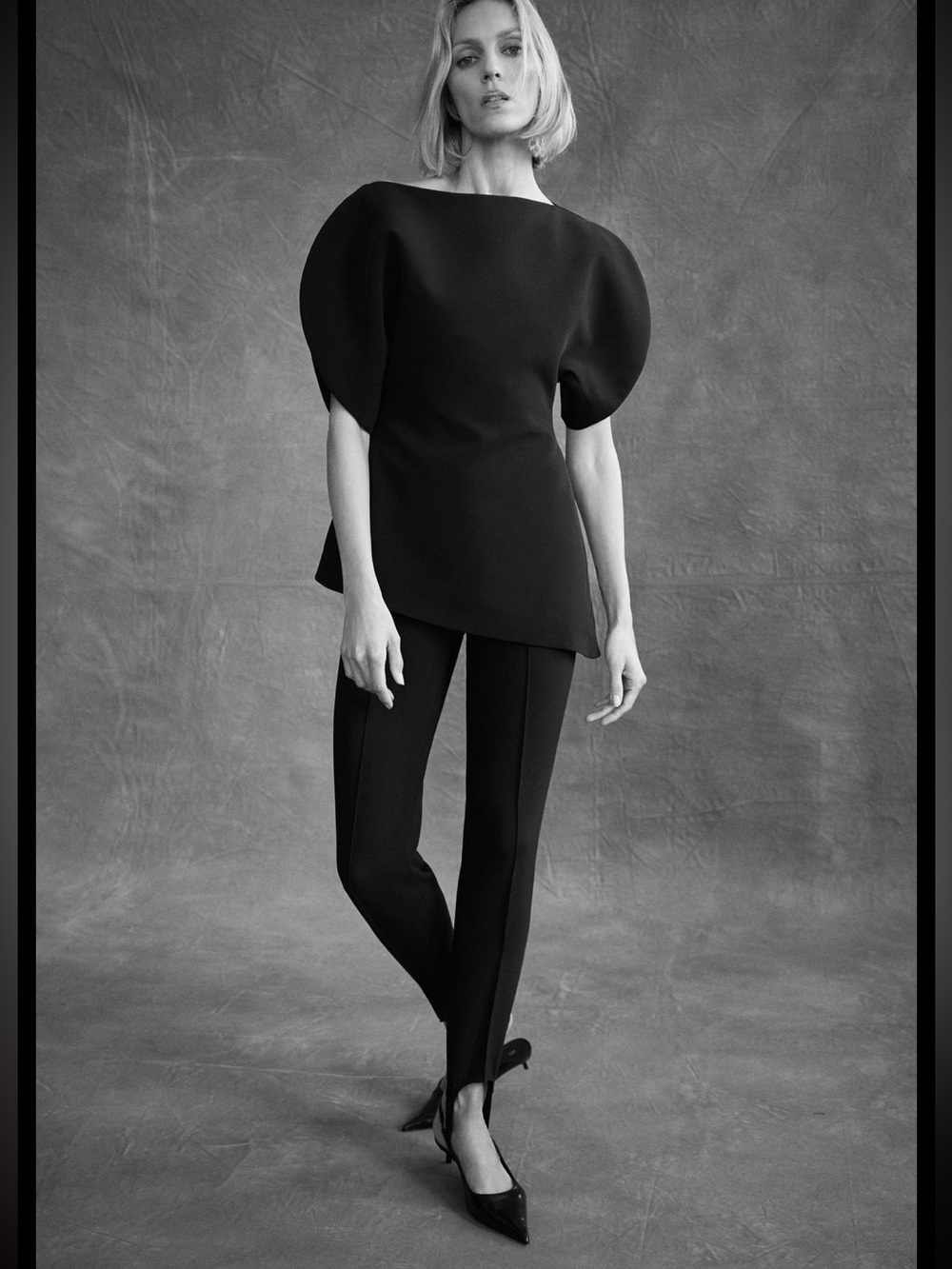 black slim-fit stirrup trousers